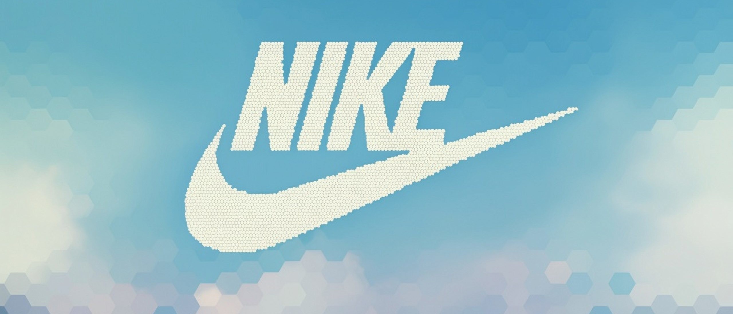 Nike logo with clouds and blue sky behind it