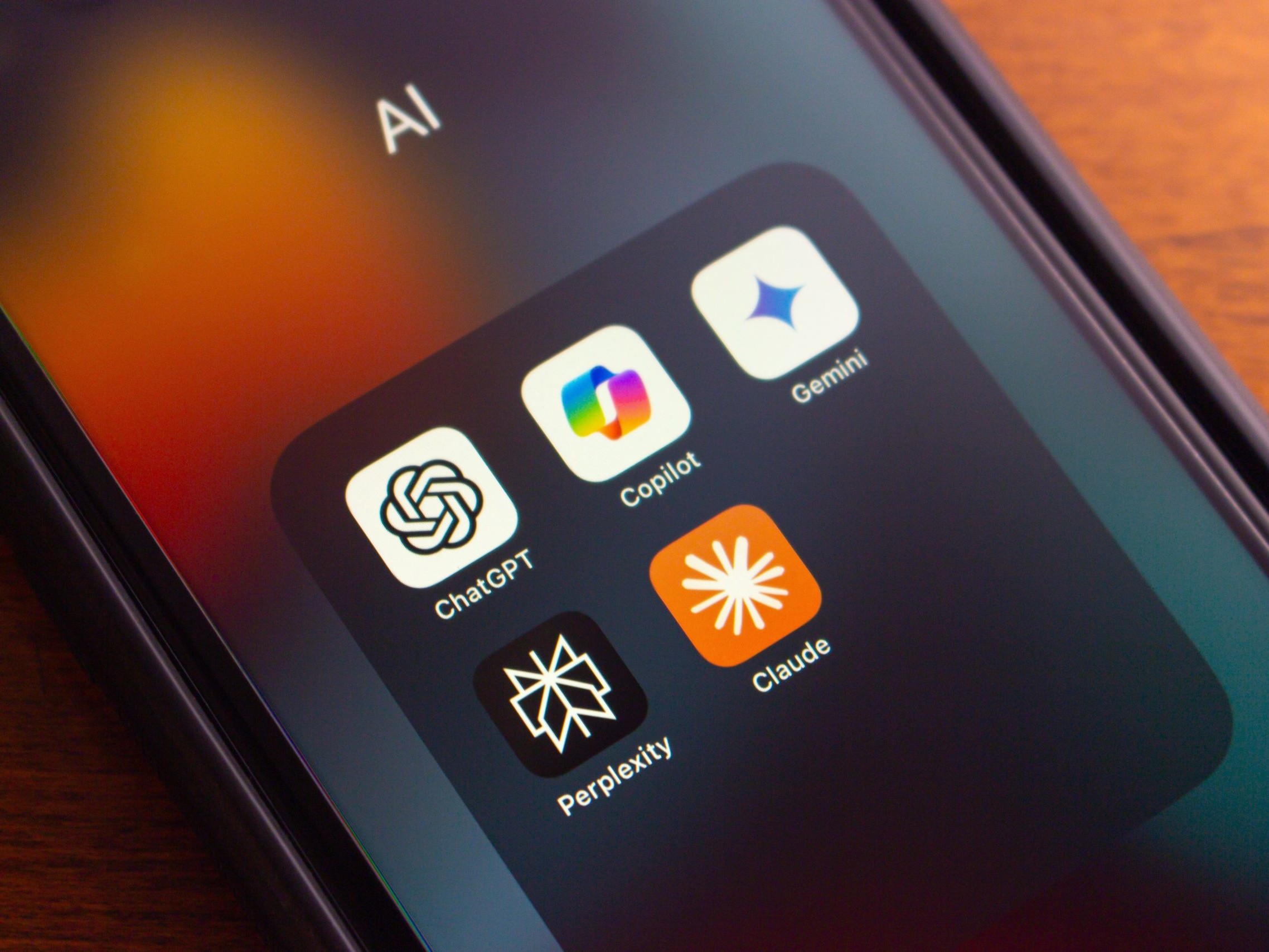 Image of phone showing AI apps