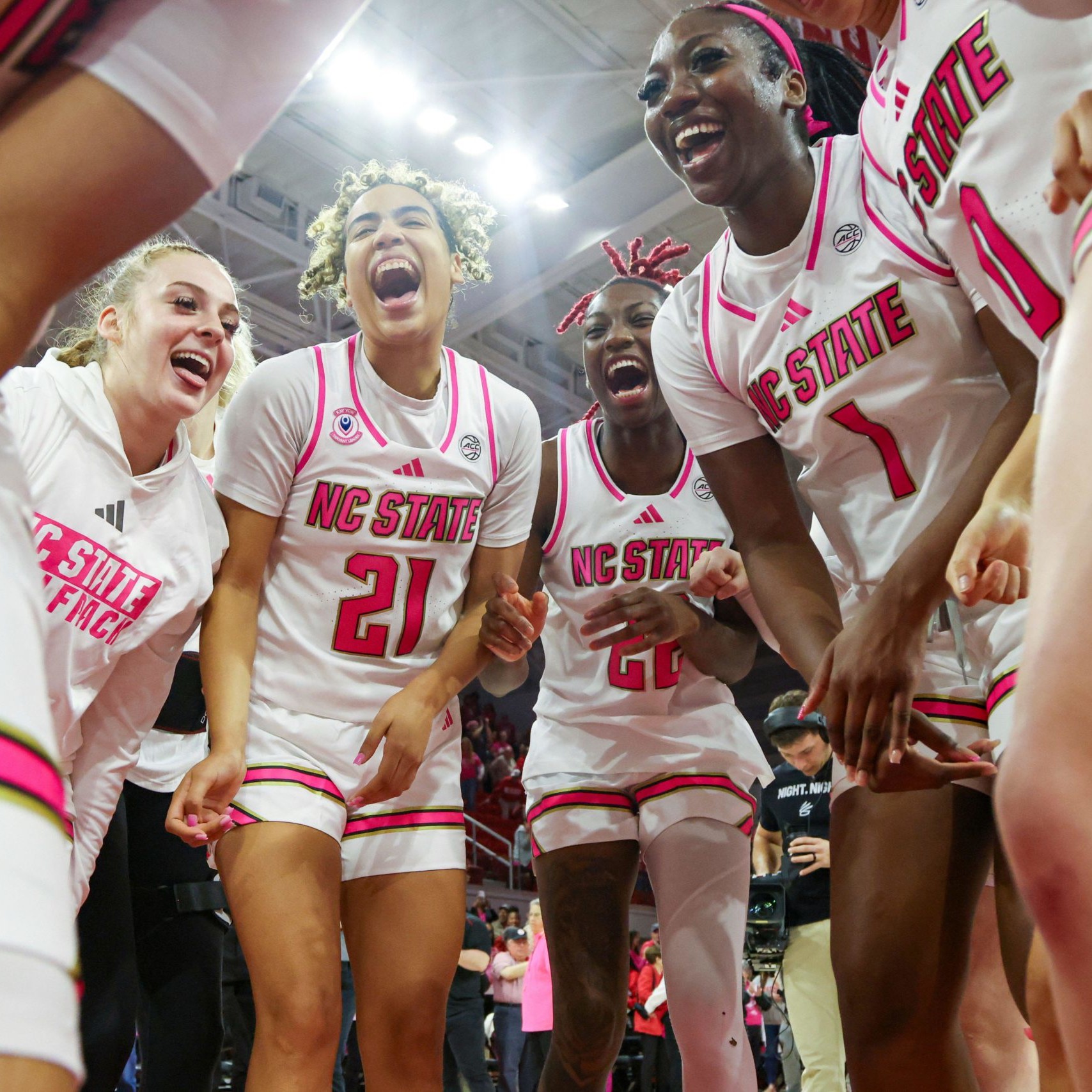 Action shot of female basketball players celebrating