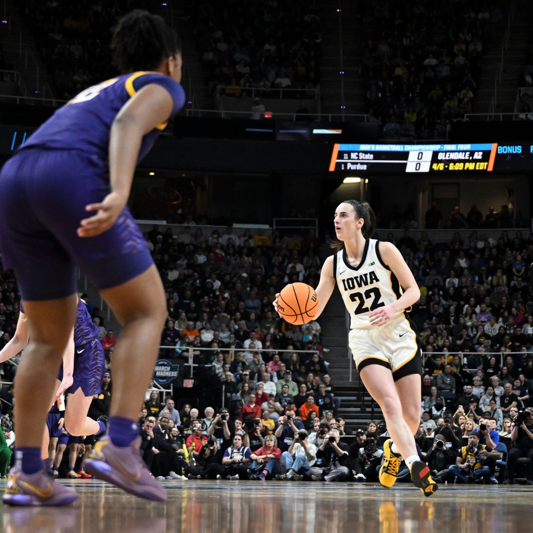 Image of Caitlin Clark 1 on 1 with another female basletball player