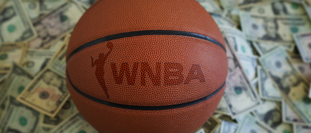 image of basketball with WNBA logo, surrounded by cash