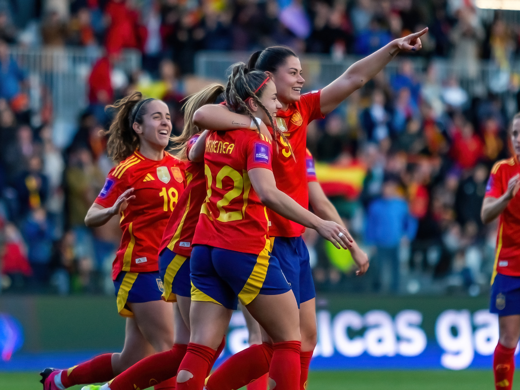 Celebration shot of womens football players - Women's Sport