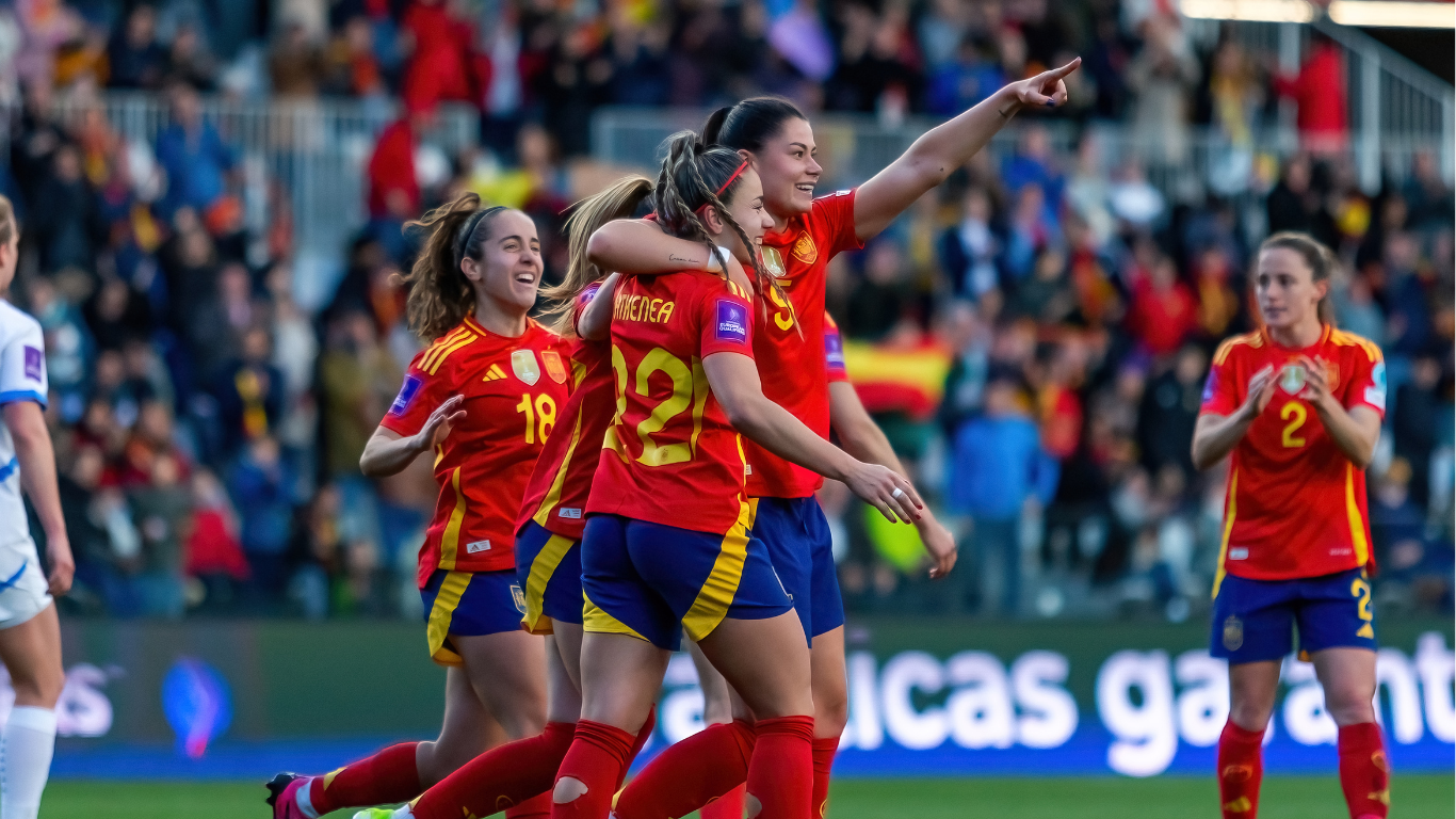 Celebration shot of womens football players - Women's Sport