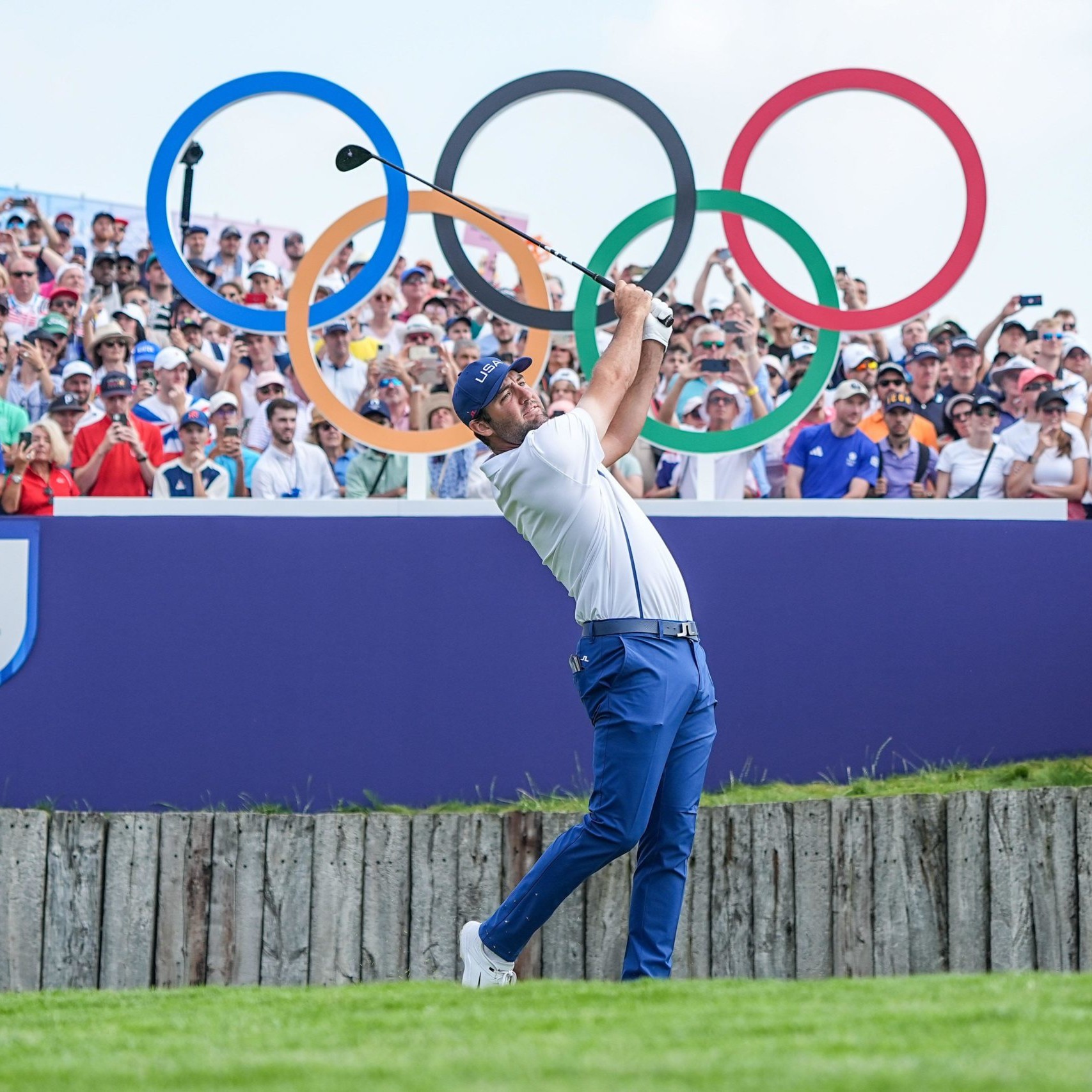 Scottie Scheffler taking tee shot at Olympic Games