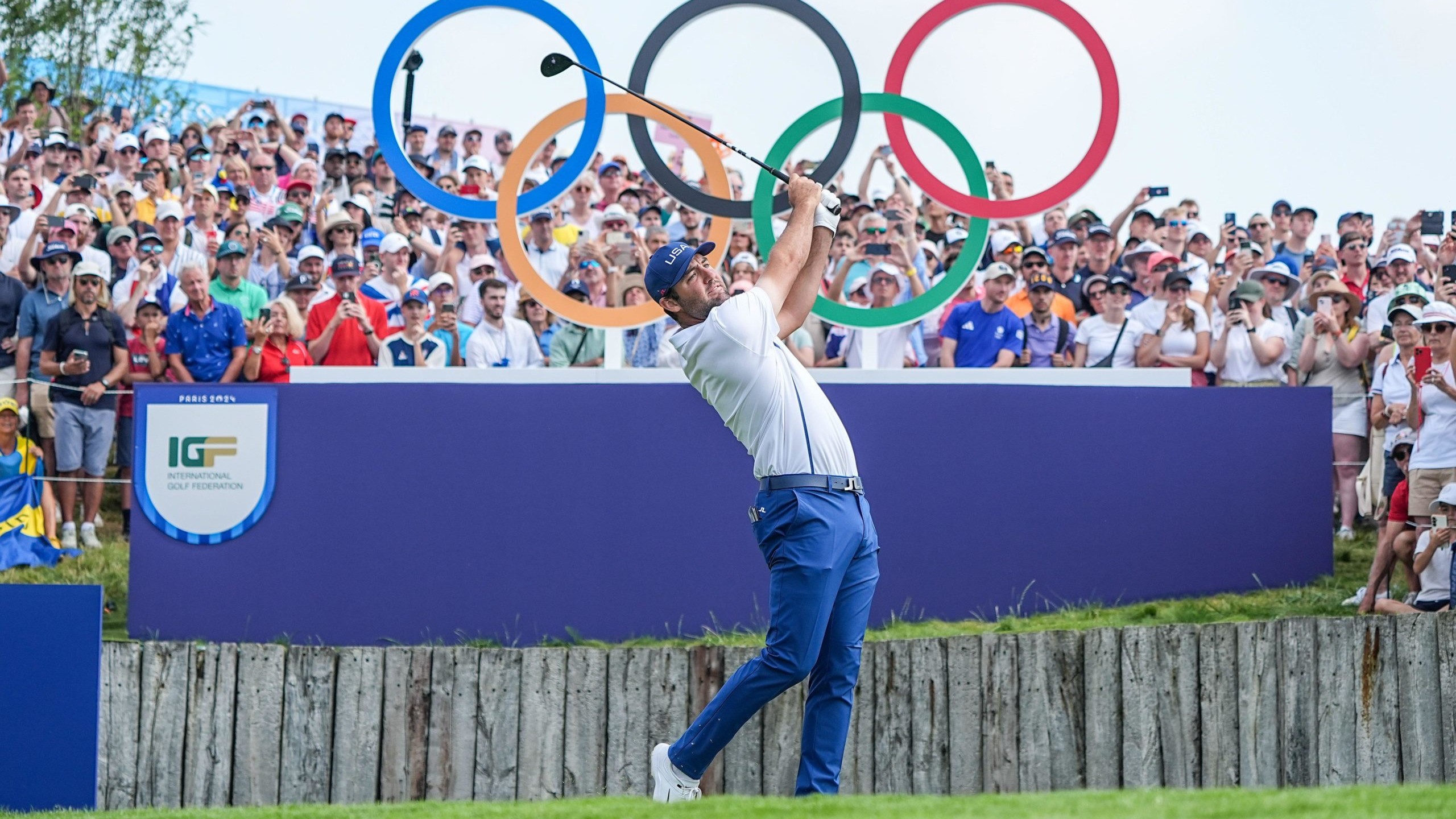 Scottie Scheffler taking tee shot at Olympic Games