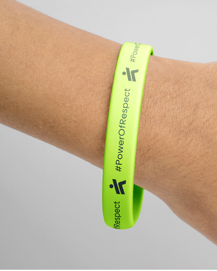 Bright green wristband with the text power of respect