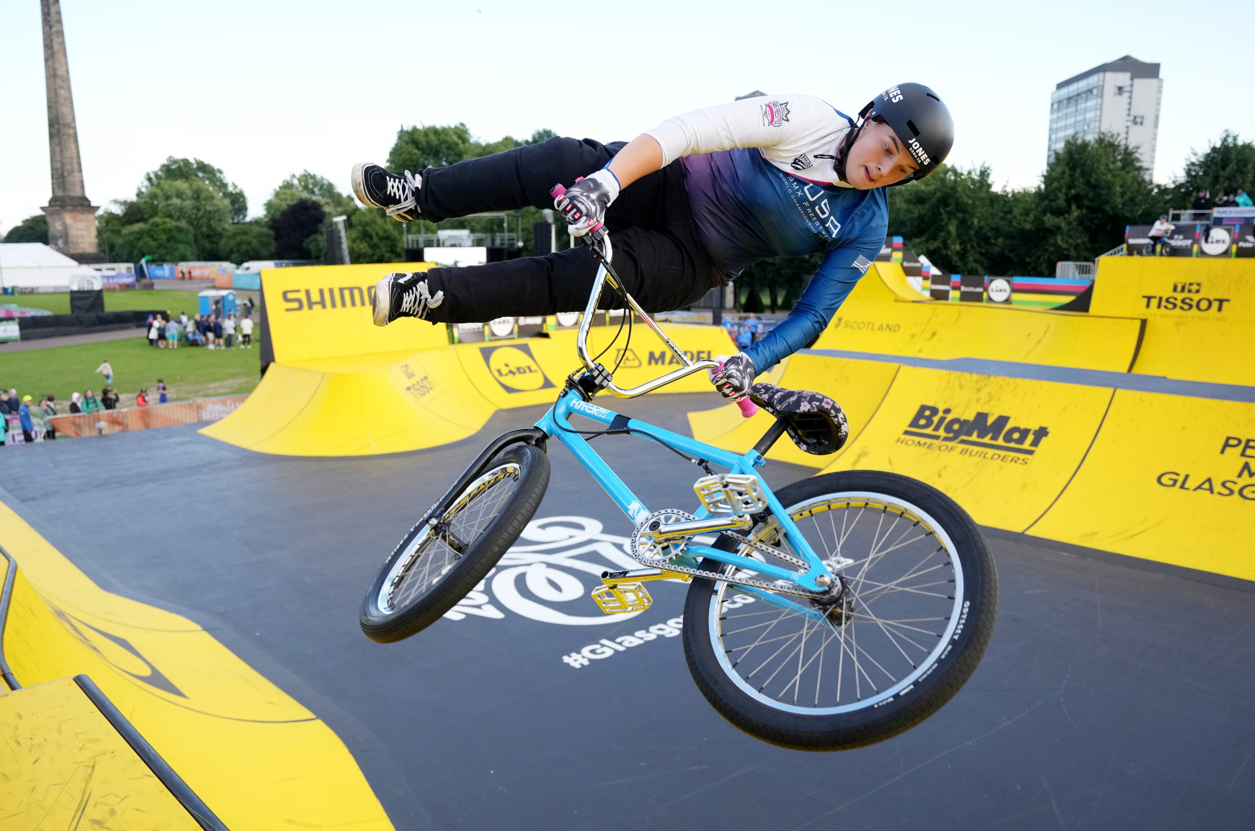 Female BMX athlete performing trick at BMX park