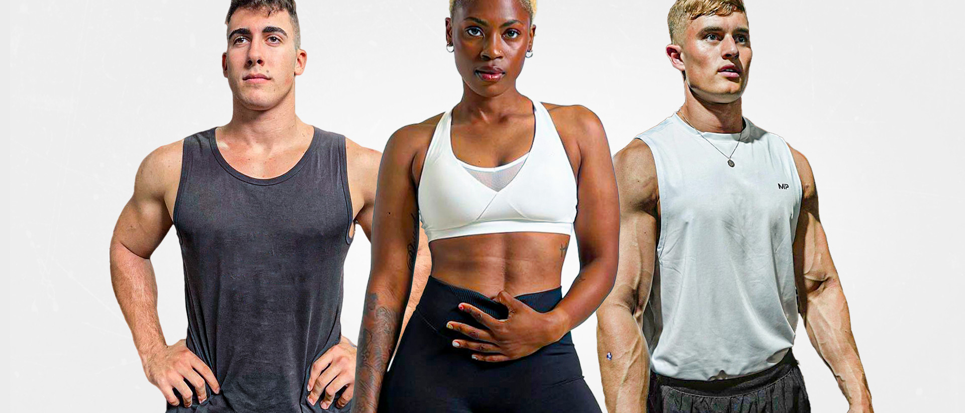 Three athletes in gym wear poising for the camera
