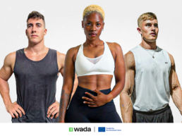 Three athletes in gym wear poising for the camera