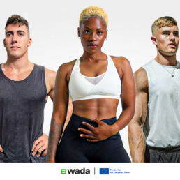 Three athletes in gym wear poising for the camera