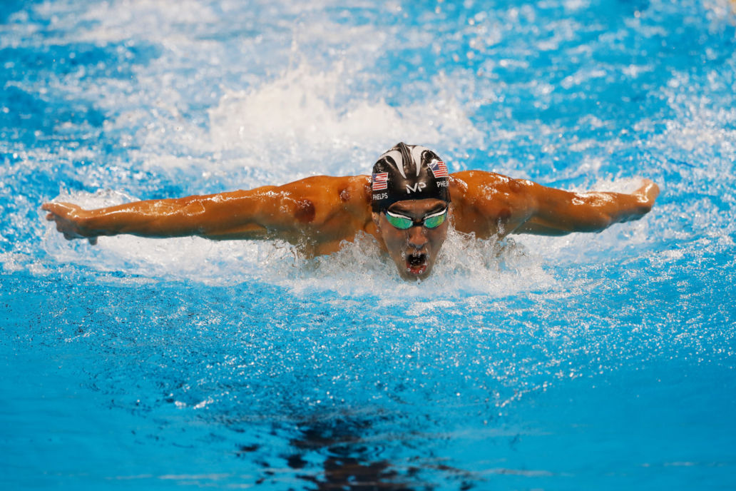 Michael Phelps mid swim performing butterfly