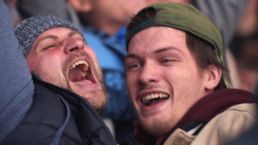 Sport in 2026 - Two emotional fans celebrate at a live sports event